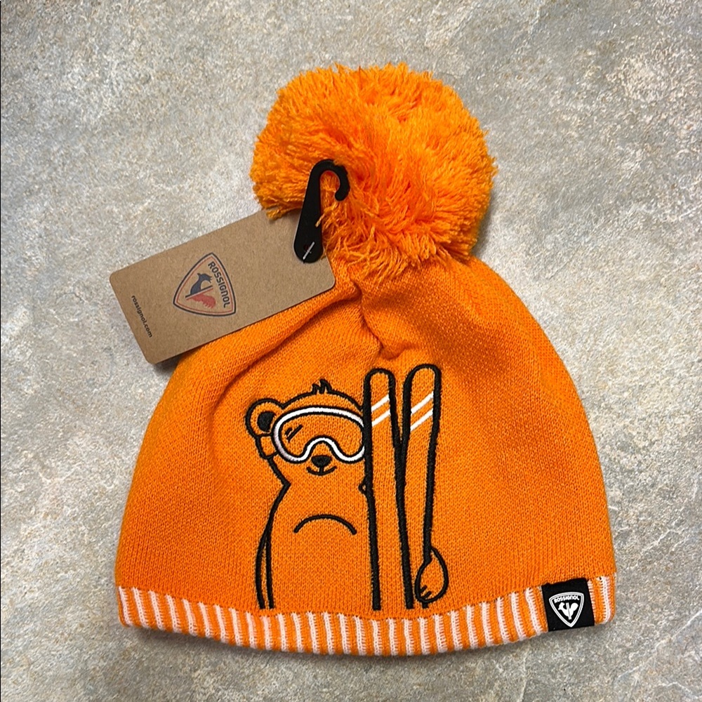 Vibrant Orange Knit Hat with Pom-Pom and Cartoon Design
